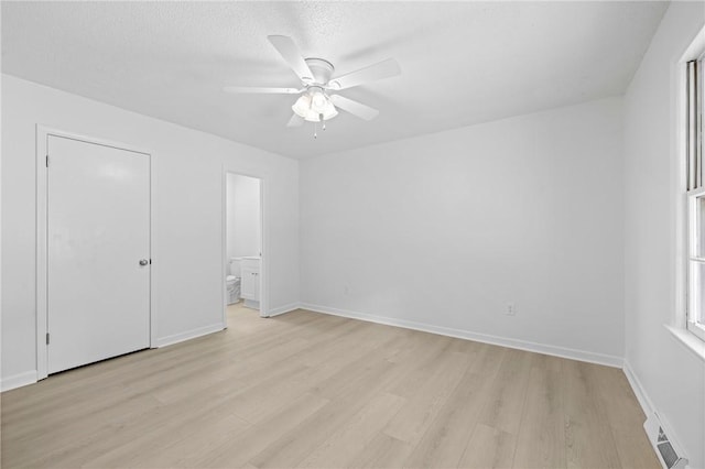 134 Evergreen Ct, Central, SC 29630 - unfurnished bedroom featuring light wood-type flooring, ensuite bath, a ceiling fan, and baseboards
