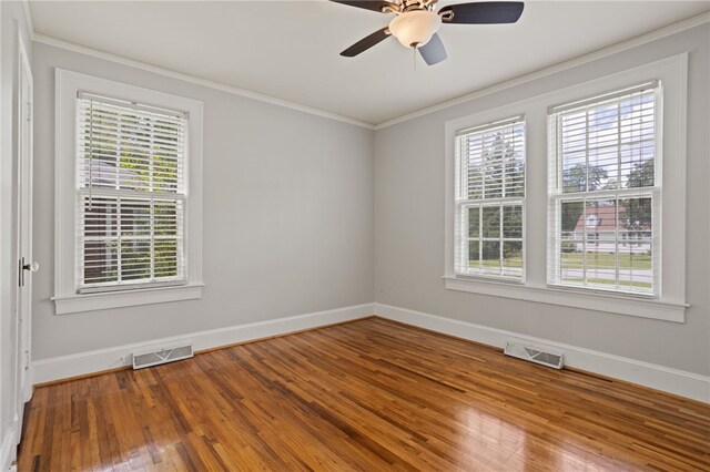 117 Henry Ave, Anderson, SC 29625 - unfurnished room featuring healthy amount of natural light, baseboards, wood finished floors, and crown molding