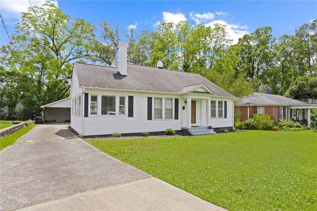 117 Henry Ave, Anderson, SC 29625 - view of front of property with a front lawn, asphalt driveway, a chimney, and a carport