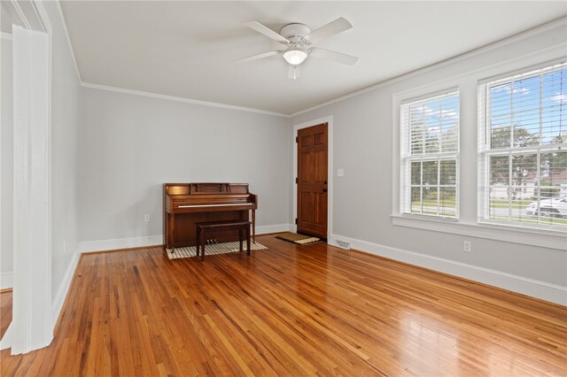 117 Henry Ave, Anderson, SC 29625 - empty room with crown molding, light wood-style floors, ceiling fan, and baseboards