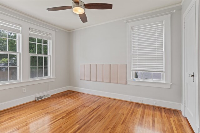 117 Henry Ave, Anderson, SC 29625 - empty room featuring light wood-style floors, crown molding, baseboards, and a ceiling fan