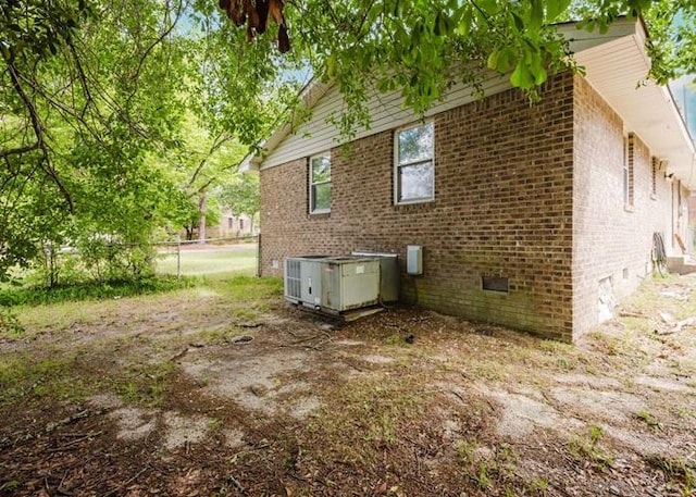 4709 Mcdonald Ave, West Columbia, SC 29172 - view of side of property with crawl space, brick siding, and central air condition unit