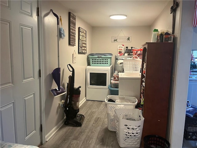 130 Marshall Ave, Seneca, SC 29678 - laundry area with wood finished floors, washing machine and clothes dryer, and baseboards