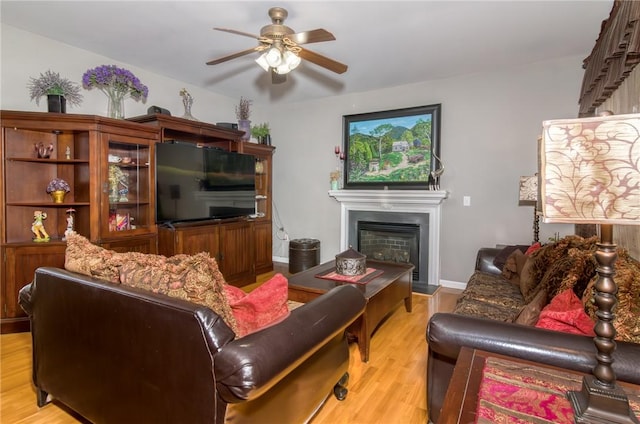 606 Greening Dr, Simpsonville, SC 29681 - living room featuring a ceiling fan, light wood-style floors, and a fireplace