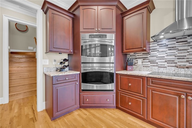 117 W Waters Edge Ln, West Union, SC 29696 - kitchen featuring double oven, wall chimney range hood, light wood-type flooring, black electric cooktop, and crown molding