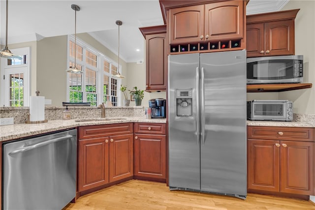 117 W Waters Edge Ln, West Union, SC 29696 - kitchen featuring stainless steel appliances, ornamental molding, a sink, pendant lighting, and light wood-style floors