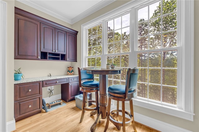 117 W Waters Edge Ln, West Union, SC 29696 - kitchen with light stone countertops, light wood-style flooring, crown molding, and reddish brown cabinets