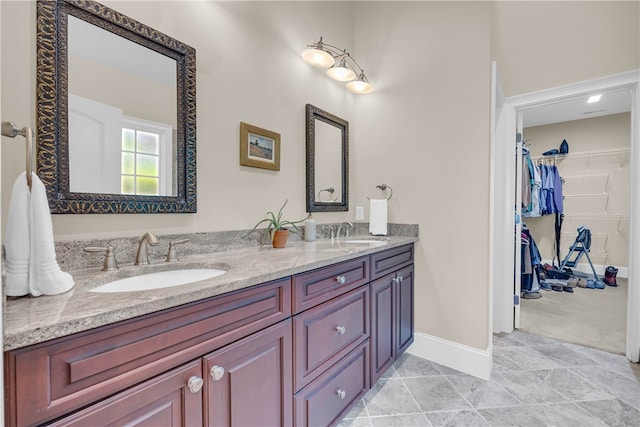 117 W Waters Edge Ln, West Union, SC 29696 - full bathroom featuring double vanity, baseboards, and a walk in closet