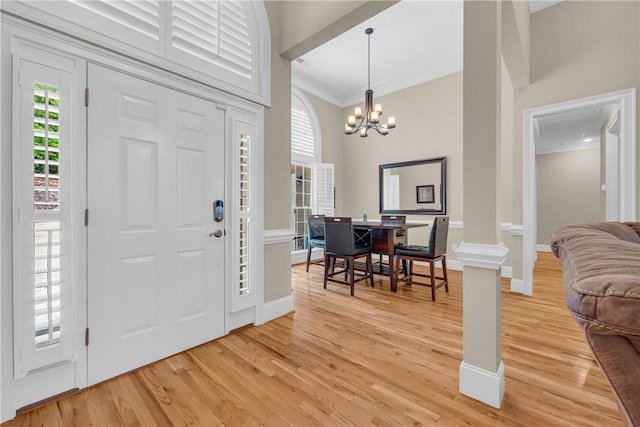 117 W Waters Edge Ln, West Union, SC 29696 - entryway with ornamental molding, light wood-style flooring, a chandelier, and baseboards