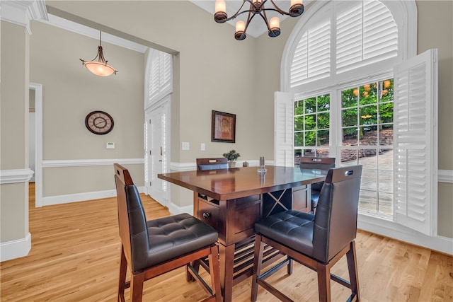 117 W Waters Edge Ln, West Union, SC 29696 - dining room with light wood-style flooring, a chandelier, and baseboards