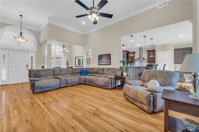 117 W Waters Edge Ln, West Union, SC 29696 - living room with a ceiling fan, crown molding, light wood finished floors, a chandelier, and recessed lighting