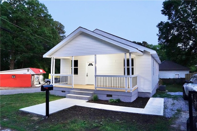 221 Foster St, Anderson, SC 29625 - view of front facade with crawl space, a porch, cooling unit, and a front yard