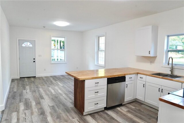 221 Foster St, Anderson, SC 29625 - kitchen featuring a sink, stainless steel dishwasher, wood counters, a peninsula, and light wood finished floors