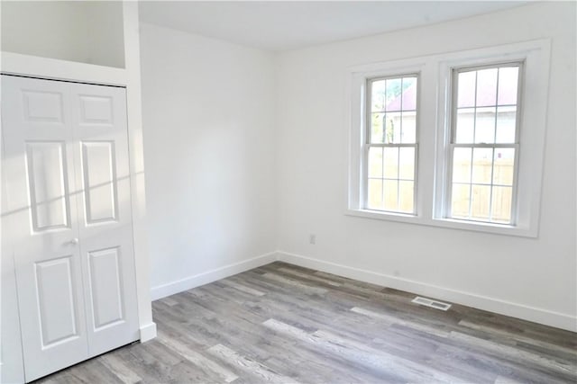 221 Foster St, Anderson, SC 29625 - unfurnished bedroom with baseboards, wood finished floors, and a closet
