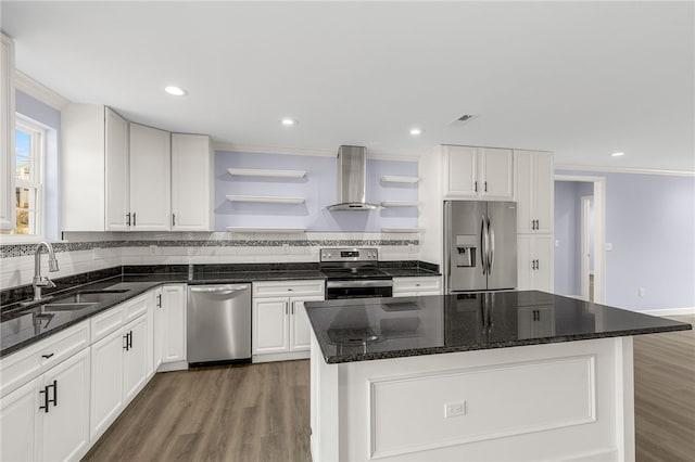 11 Arlington Rd, Greer, SC 29651 - kitchen with appliances with stainless steel finishes, wall chimney range hood, a sink, open shelves, and crown molding