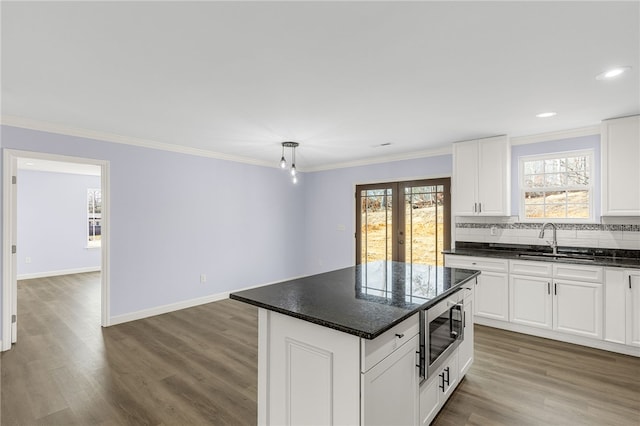 11 Arlington Rd, Greer, SC 29651 - kitchen with a sink, stainless steel microwave, french doors, wood finished floors, and recessed lighting