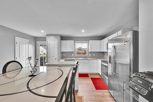145 Queens Mill Ct, Pendleton, SC 29670 - kitchen featuring stainless steel appliances, a sink, light wood-type flooring, white cabinetry, and recessed lighting