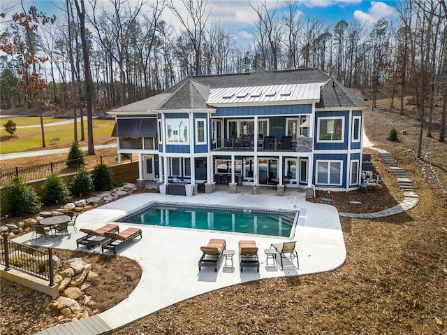 656 Bark Shed Trl, Seneca, SC 29672 - rear view of house featuring a balcony, board and batten siding, a patio area, and roof with shingles