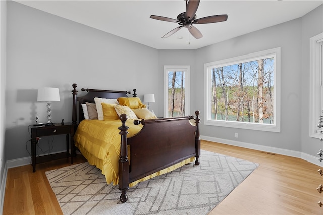656 Bark Shed Trl, Seneca, SC 29672 - bedroom with light wood-style flooring, baseboards, and a ceiling fan