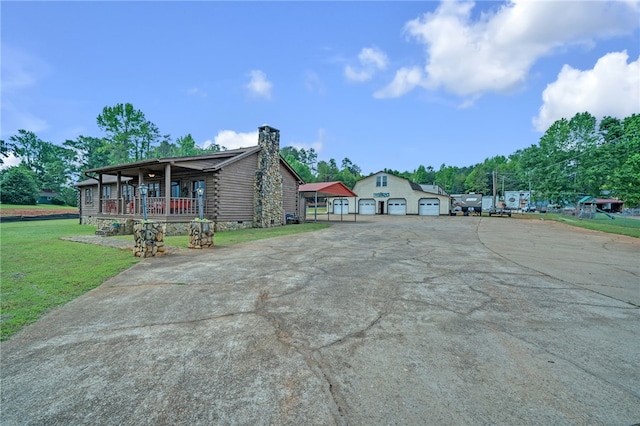 60 Lakeside Dr, Lyman, SC 29365 - view of front of home with a porch, a chimney, a front yard, and log siding
