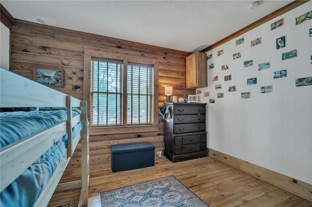 60 Lakeside Dr, Lyman, SC 29365 - bedroom with a textured ceiling, wood finished floors, baseboards, and log walls