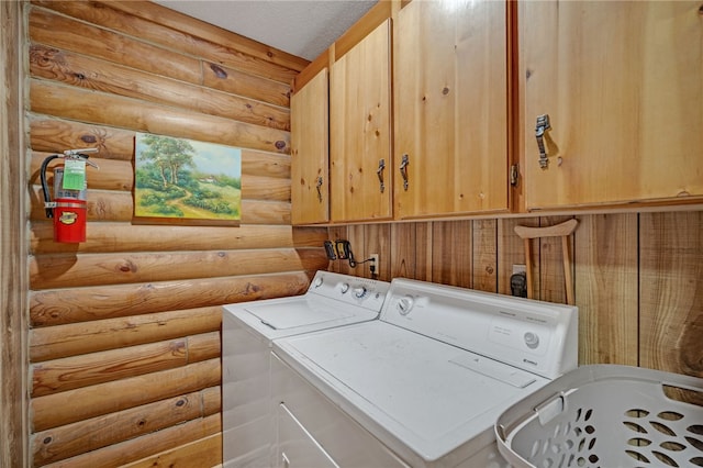 60 Lakeside Dr, Lyman, SC 29365 - laundry area featuring cabinet space, washing machine and dryer, and rustic walls