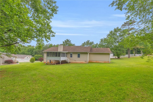 211 Jana Dr, Walhalla, SC 29691 - rear view of property featuring a chimney, a sunroom, and a yard