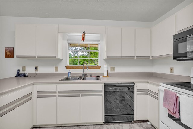211 Jana Dr, Walhalla, SC 29691 - kitchen with black appliances, a sink, light countertops, and white cabinets