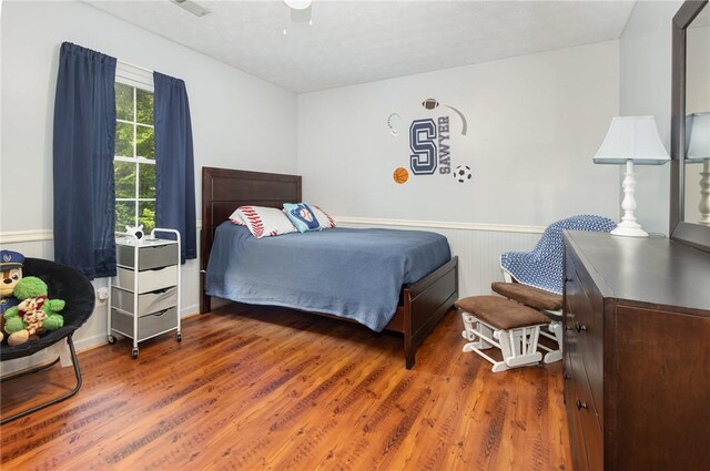 108 Ascot Ct, Easley, SC 29642 - bedroom with wood finished floors, wainscoting, and ceiling fan