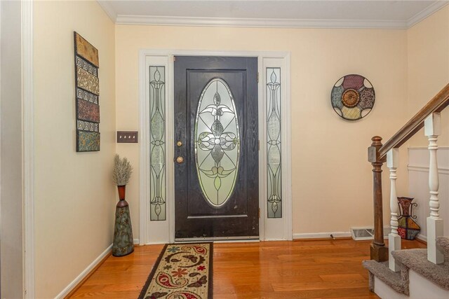 108 Ascot Ct, Easley, SC 29642 - foyer featuring stairway, wood finished floors, baseboards, and crown molding