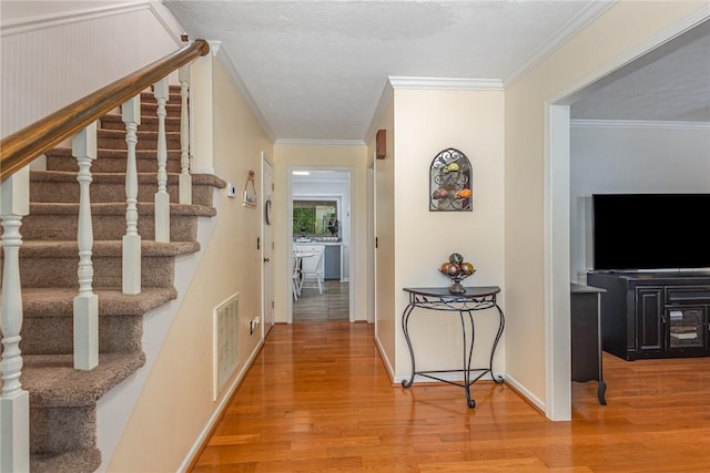 108 Ascot Ct, Easley, SC 29642 - hallway with wood finished floors, stairway, baseboards, and ornamental molding