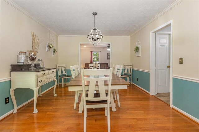 108 Ascot Ct, Easley, SC 29642 - dining space featuring a ceiling fan, a chandelier, light wood-style floors, baseboards, and ornamental molding