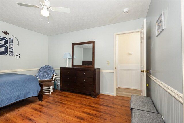 108 Ascot Ct, Easley, SC 29642 - bedroom featuring wood finished floors, a ceiling fan, and a wainscoted wall