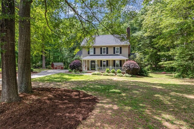 108 Ascot Ct, Easley, SC 29642 - colonial-style house featuring covered porch, a chimney, and a front lawn