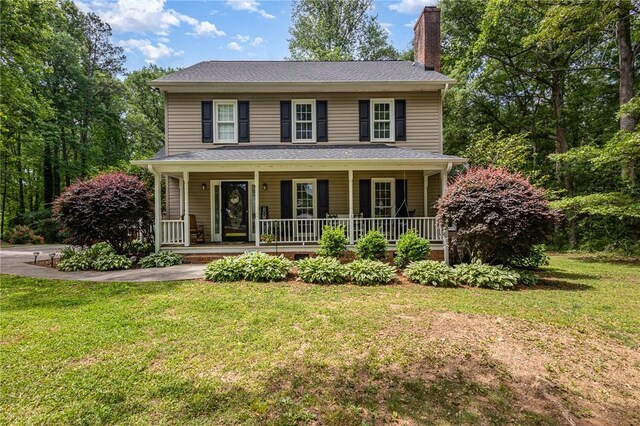 108 Ascot Ct, Easley, SC 29642 - view of front of house with a chimney, a front yard, and a porch