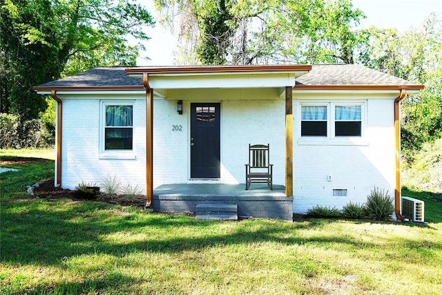 202 S Broad St, Westminster, SC 29693 - bungalow featuring a front lawn, brick siding, and a shingled roof