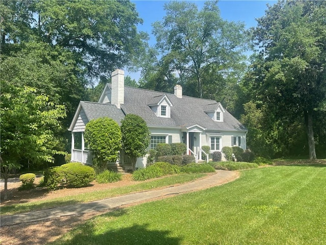 501 Seneca Dr, Seneca, SC 29678 - new england style home with a front yard, a chimney, and a shingled roof