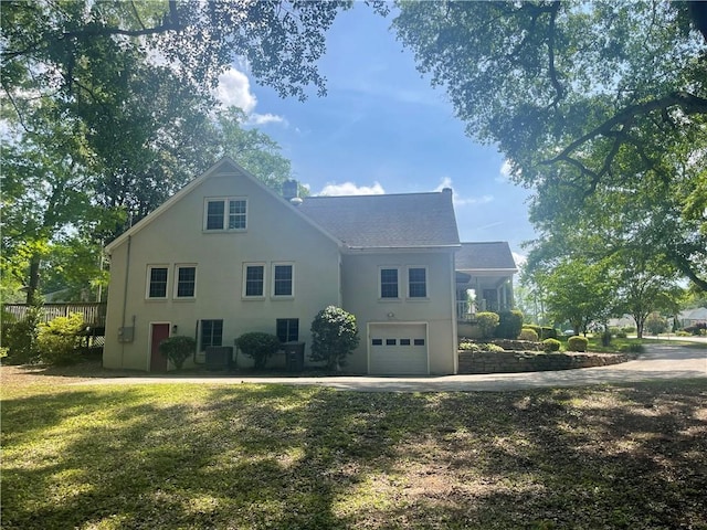 501 Seneca Dr, Seneca, SC 29678 - view of side of home with a garage, stucco siding, and concrete driveway