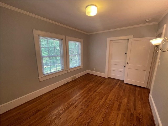 501 Seneca Dr, Seneca, SC 29678 - empty room with dark wood-style flooring, baseboards, crown molding, and a smoke detector