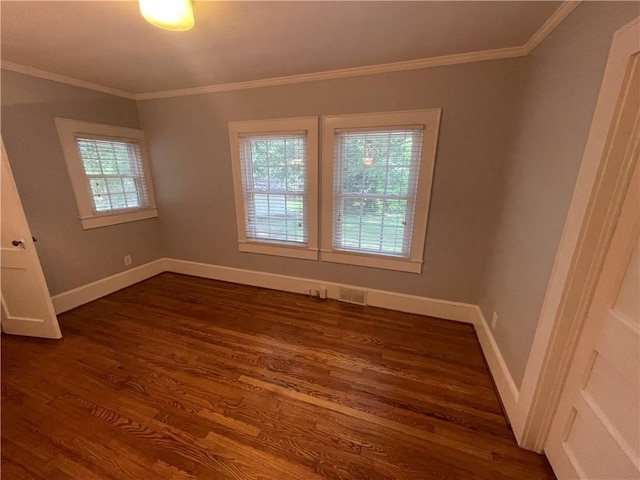 501 Seneca Dr, Seneca, SC 29678 - spare room featuring dark wood finished floors, ornamental molding, and baseboards