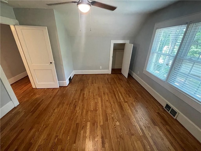 501 Seneca Dr, Seneca, SC 29678 - unfurnished bedroom featuring vaulted ceiling, wood finished floors, baseboards, ceiling fan, and a closet
