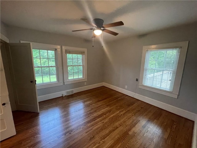 501 Seneca Dr, Seneca, SC 29678 - spare room with a ceiling fan, baseboards, and dark wood finished floors