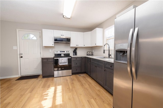 410 S Cove Rd, Seneca, SC 29672 - kitchen featuring stainless steel appliances, light wood-type flooring, plenty of natural light, and light countertops