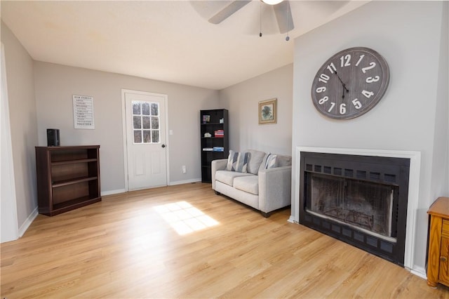 410 S Cove Rd, Seneca, SC 29672 - living area featuring light wood-style floors, ceiling fan, a fireplace, and baseboards