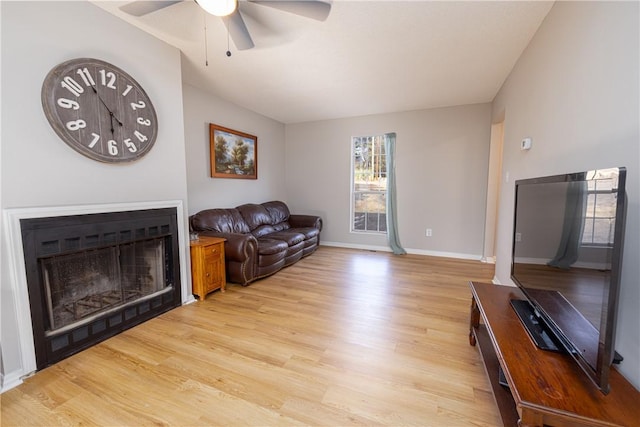 410 S Cove Rd, Seneca, SC 29672 - living room featuring light wood-style floors, ceiling fan, a fireplace, and baseboards
