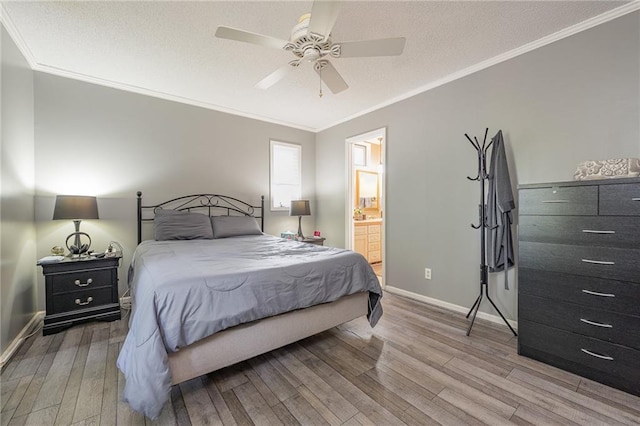 261 N Mcallister Rd, Liberty, SC 29657 - bedroom with light wood-style flooring, crown molding, baseboards, a ceiling fan, and ensuite bathroom