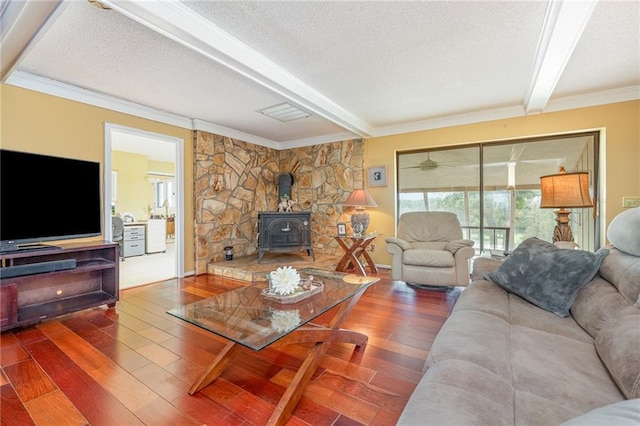 261 N Mcallister Rd, Liberty, SC 29657 - living room with beamed ceiling, a wood stove, wood finished floors, a textured ceiling, and crown molding