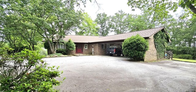 261 N Mcallister Rd, Liberty, SC 29657 - view of front of home featuring asphalt driveway, brick siding, and an attached carport