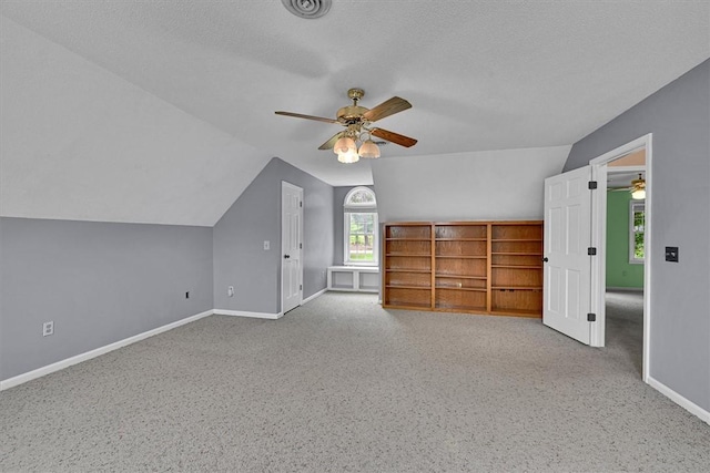1208 Marett Rd, Pendleton, SC 29670 - bonus room featuring a ceiling fan, vaulted ceiling, baseboards, carpet, and a textured ceiling