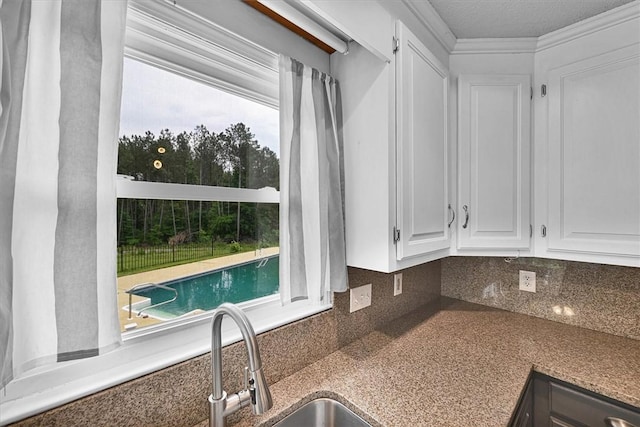 1208 Marett Rd, Pendleton, SC 29670 - kitchen featuring white cabinetry, tasteful backsplash, and a sink